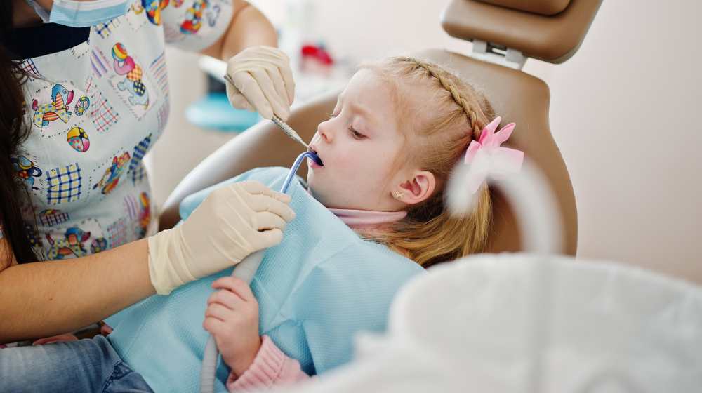 Freepik "Free photo little baby girl at dentist chair children dental" by ASphotofamily